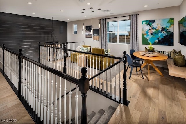 interior space with wood finished floors, visible vents, and recessed lighting