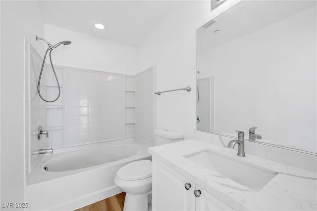 full bath featuring toilet, wood finished floors, visible vents, vanity, and bathing tub / shower combination