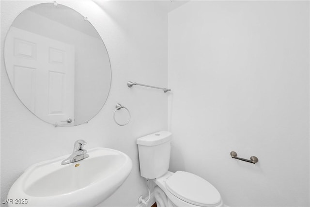 bathroom with a sink and toilet