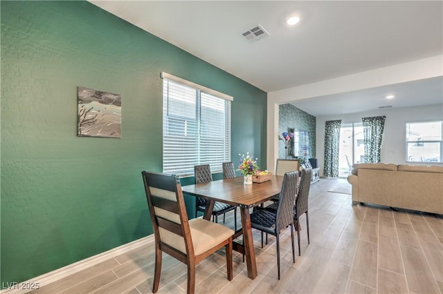 dining room with recessed lighting, light wood-type flooring, visible vents, and baseboards