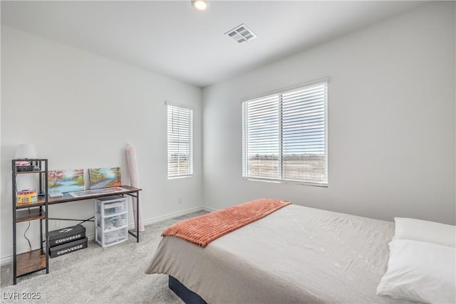 bedroom with light carpet, baseboards, and visible vents