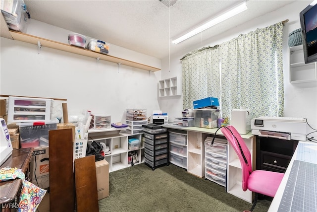 office space featuring dark carpet and a textured ceiling