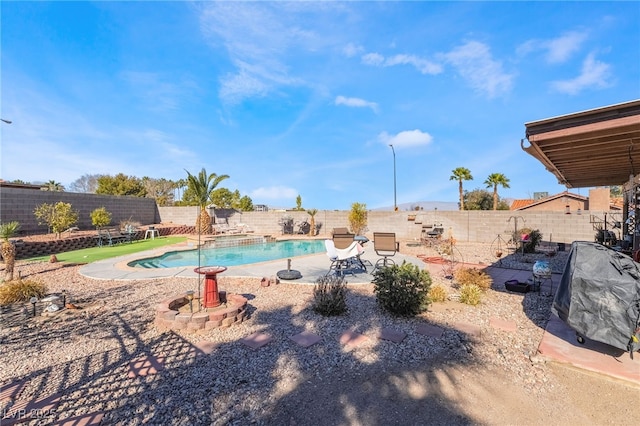 view of pool with a fenced backyard, a fenced in pool, and a patio