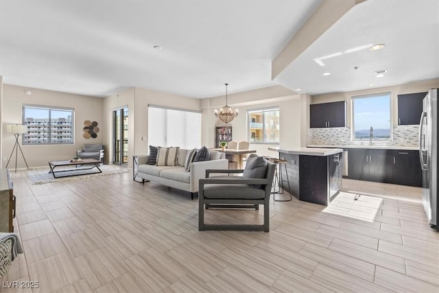 living room featuring a chandelier