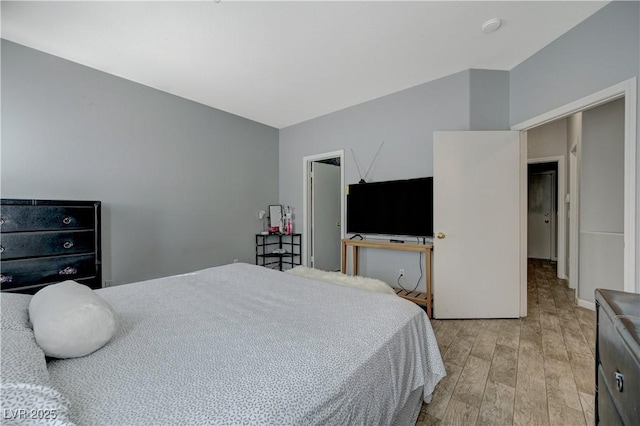 bedroom featuring light wood-style flooring