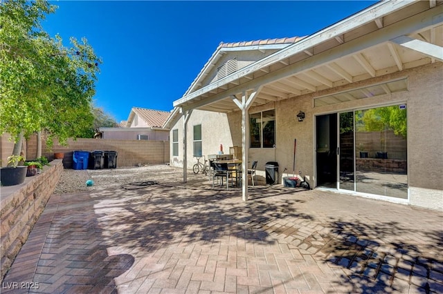 view of patio / terrace featuring fence