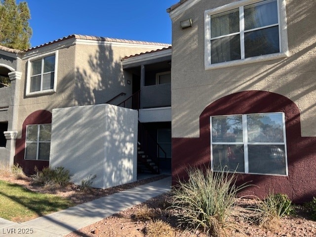 view of side of property featuring stucco siding