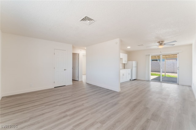 1817 Allen Ave, Henderson, NV 89011 - unfurnished living room featuring baseboards, a textured ceiling, a ceiling fan, and light wood finished floors