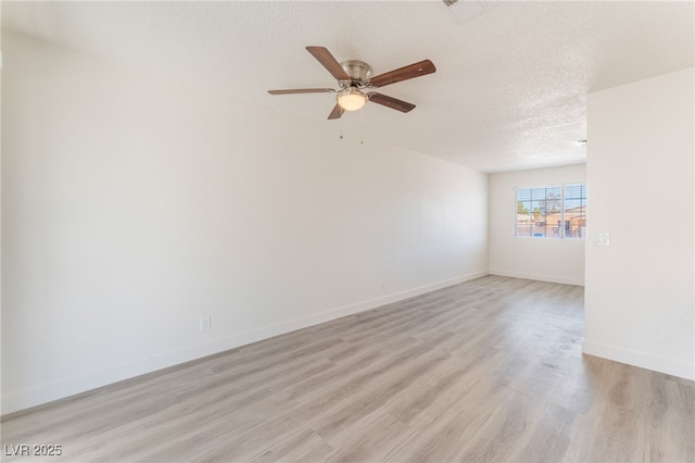 1817 Allen Ave, Henderson, NV 89011 - empty room featuring light wood finished floors, baseboards, ceiling fan, and a textured ceiling