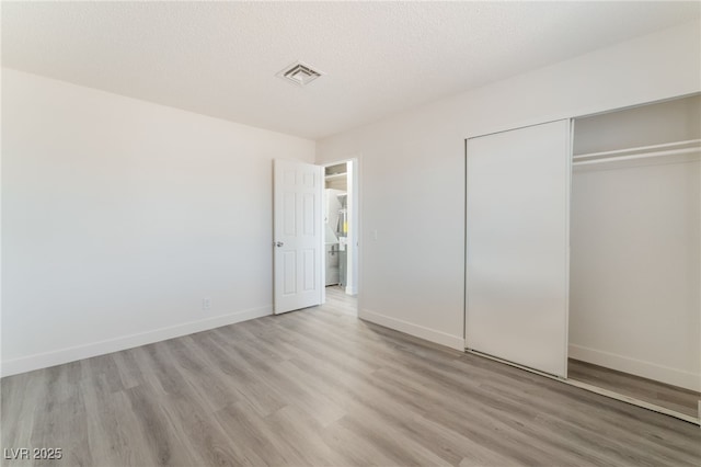 1817 Allen Ave, Henderson, NV 89011 - unfurnished bedroom with baseboards, visible vents, a closet, and light wood-style floors