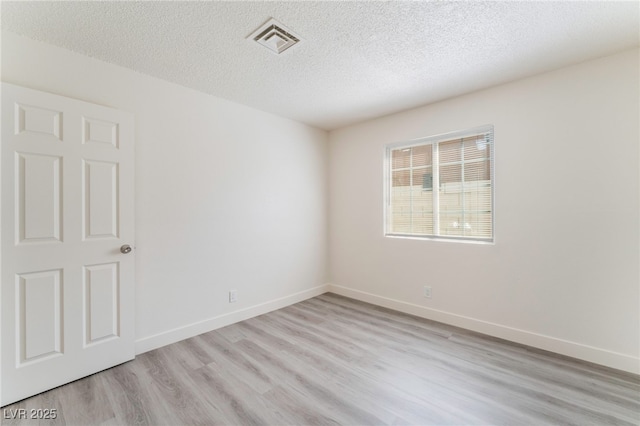1817 Allen Ave, Henderson, NV 89011 - unfurnished room featuring baseboards, a textured ceiling, visible vents, and light wood-type flooring