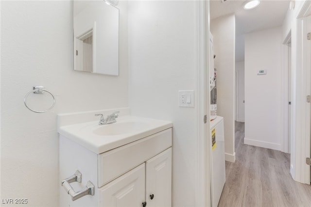 1817 Allen Ave, Henderson, NV 89011 - bathroom with baseboards, wood finished floors, and vanity