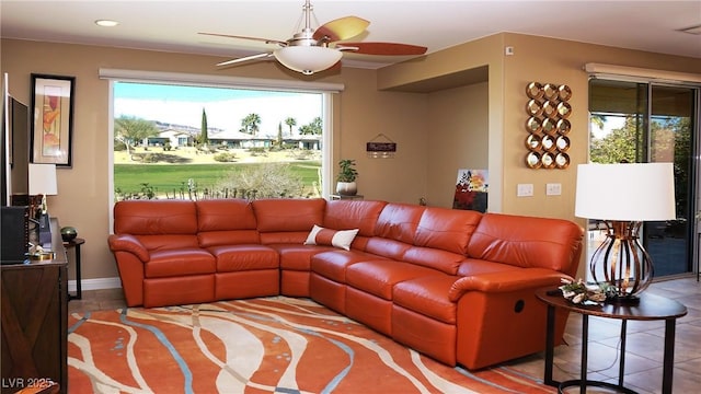 living room featuring tile patterned flooring and a ceiling fan