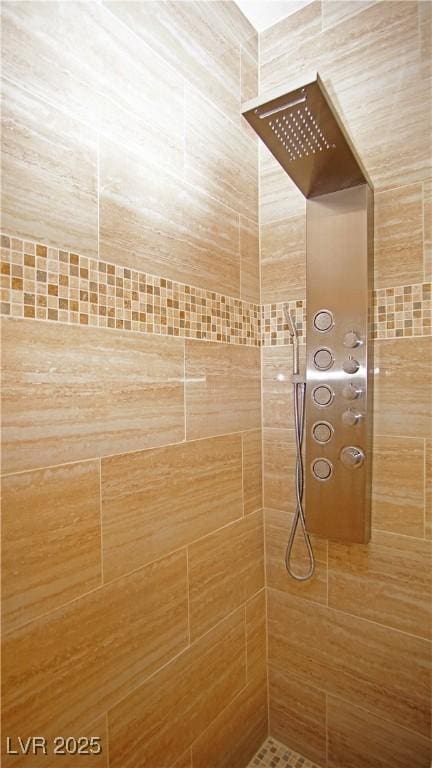 details with a tile shower