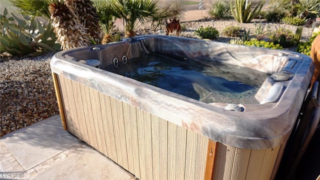 view of pool featuring a hot tub