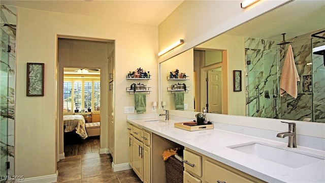 full bathroom with ensuite bathroom, double vanity, a sink, and a marble finish shower