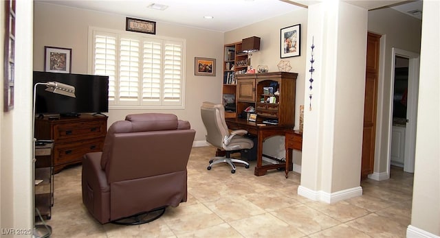 office area with visible vents, baseboards, and light tile patterned floors