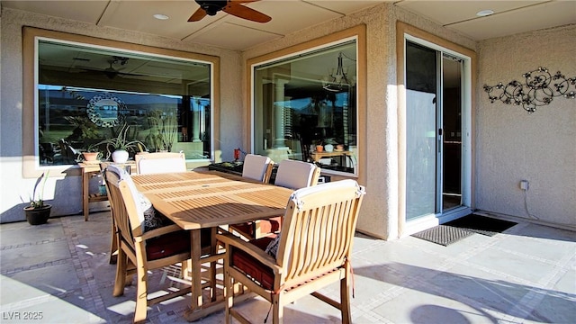 view of patio featuring ceiling fan and outdoor dining area