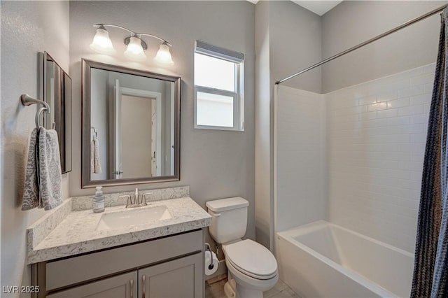 bathroom featuring toilet, washtub / shower combination, and vanity