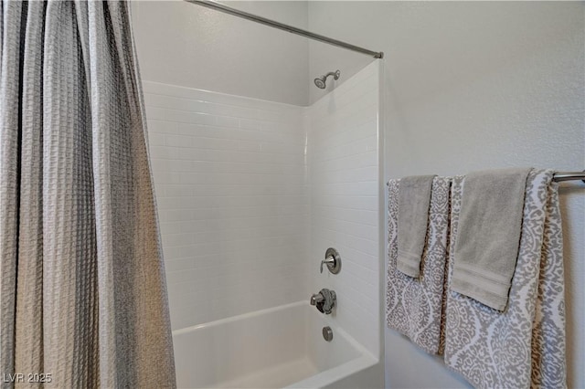 full bathroom with shower / bath combo