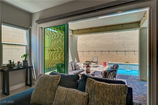 interior space featuring an outdoor hangout area and an outdoor pool