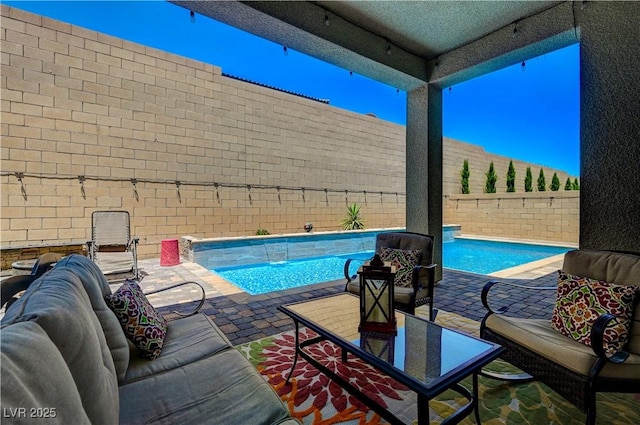 view of pool with a fenced backyard, an outdoor living space, a fenced in pool, and a patio