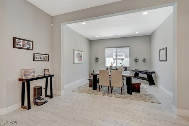 dining space featuring recessed lighting, wood finished floors, and baseboards