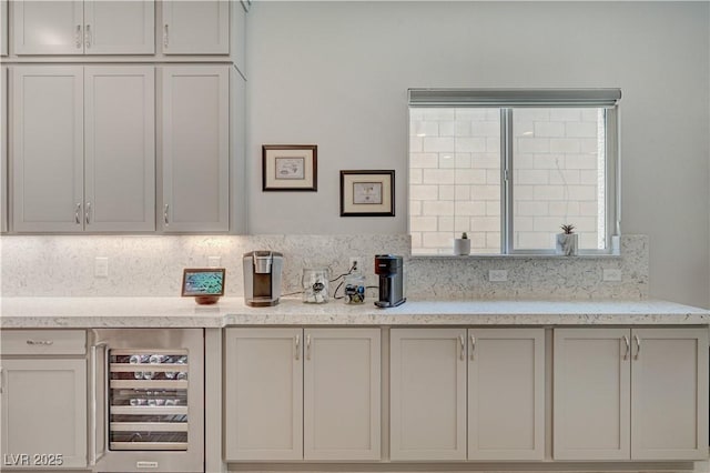 kitchen with beverage cooler and backsplash