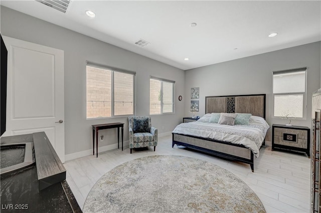 bedroom with baseboards, visible vents, and recessed lighting