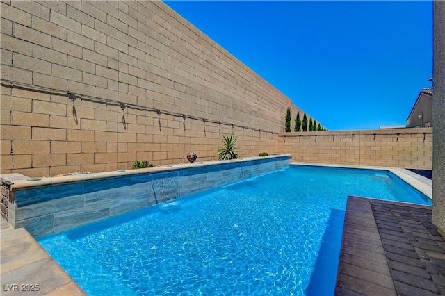 view of swimming pool featuring a fenced backyard and a fenced in pool