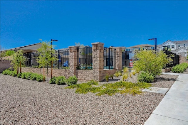 view of side of home featuring a residential view and fence