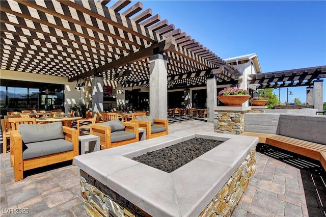 view of patio featuring an outdoor fire pit and outdoor dining area