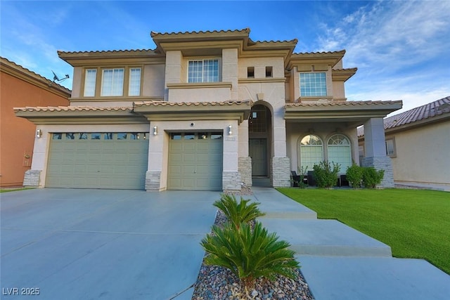 mediterranean / spanish-style home with a garage, a front yard, concrete driveway, and stucco siding