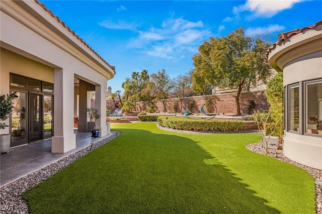 view of yard with a patio and fence