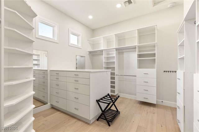 spacious closet featuring light wood-style floors and visible vents