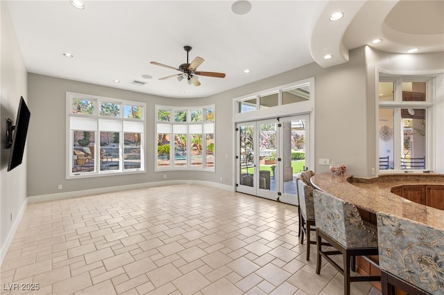 interior space with baseboards and recessed lighting