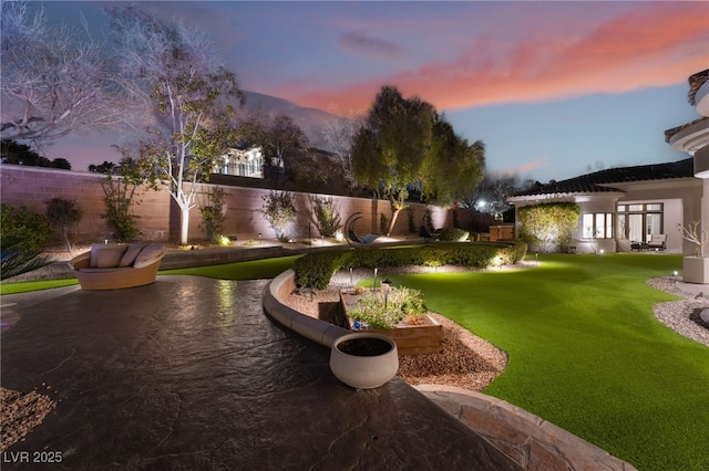 view of yard featuring a patio and a fenced backyard