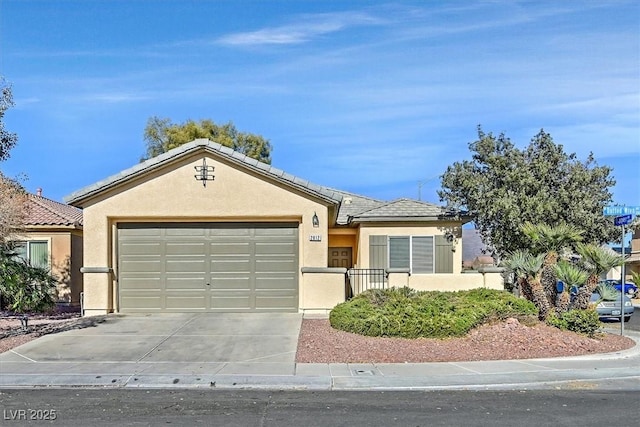 ranch-style home with driveway, an attached garage, a tiled roof, and stucco siding