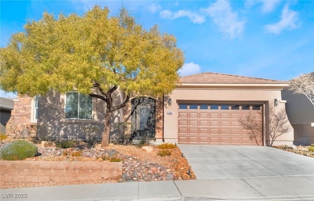 view of front of property with a garage, driveway, and stucco siding