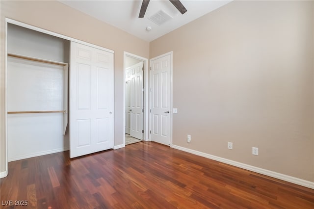 unfurnished bedroom with a ceiling fan, wood finished floors, visible vents, and baseboards