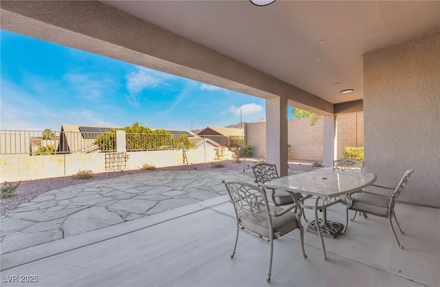 view of patio featuring outdoor dining space and a fenced backyard