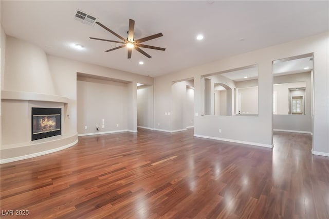 unfurnished living room featuring visible vents, ceiling fan, wood finished floors, a fireplace, and recessed lighting