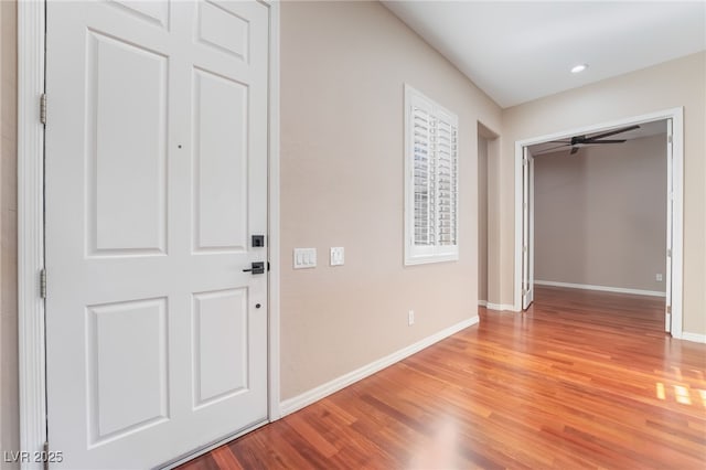 foyer entrance with light wood-style floors, baseboards, a ceiling fan, and recessed lighting