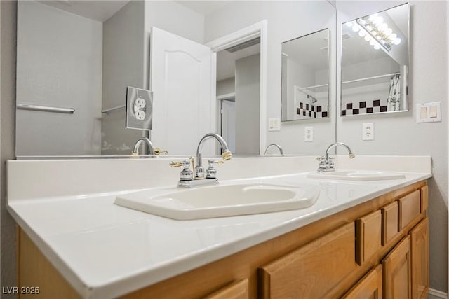 full bath featuring double vanity and a sink