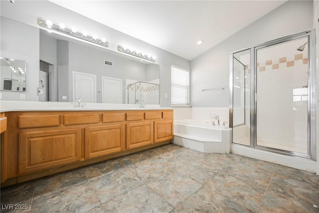 bathroom with a sink, vaulted ceiling, a shower stall, a bath, and double vanity