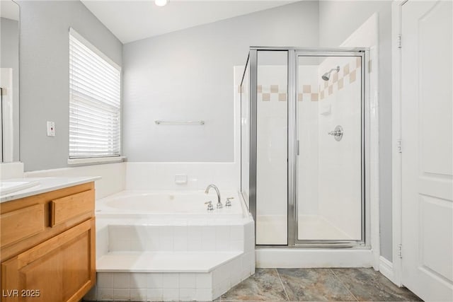 full bathroom featuring a garden tub, vanity, and a shower stall