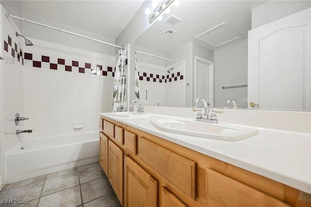 bathroom with double vanity, visible vents, shower / bath combo with shower curtain, and a sink