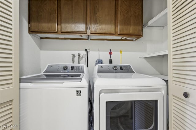 clothes washing area with cabinet space and separate washer and dryer