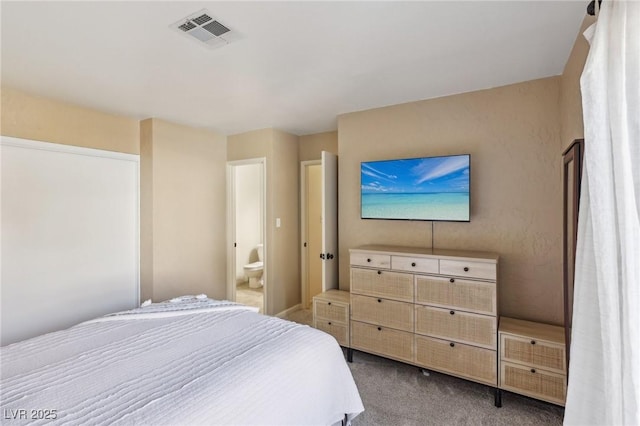 bedroom featuring dark colored carpet and visible vents