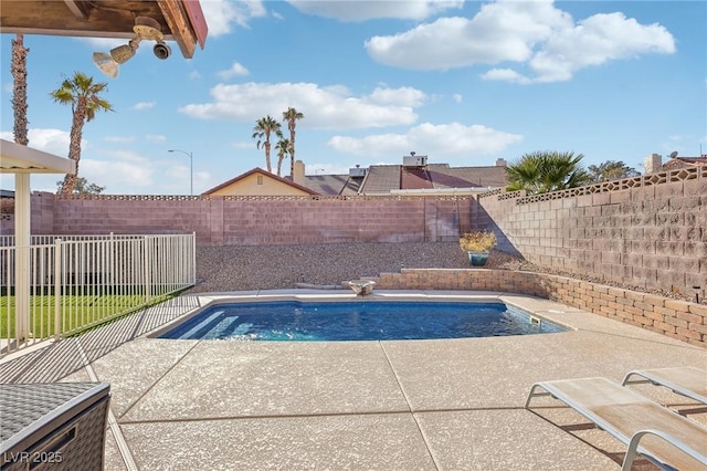 view of swimming pool with a patio area, a fenced backyard, and a fenced in pool